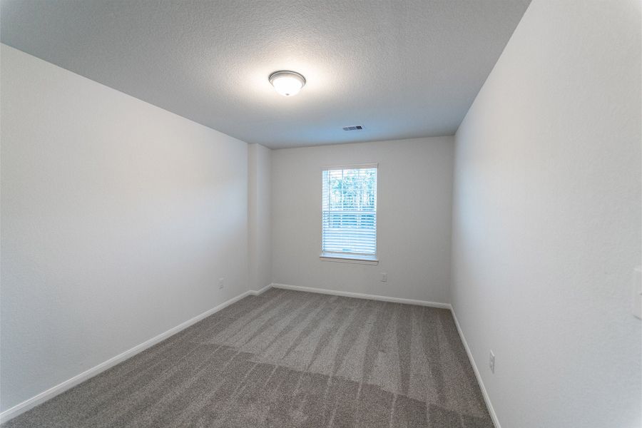 Spacious, unfurnished interior of a new home in Caney Mills, Conroe (Image 44).
