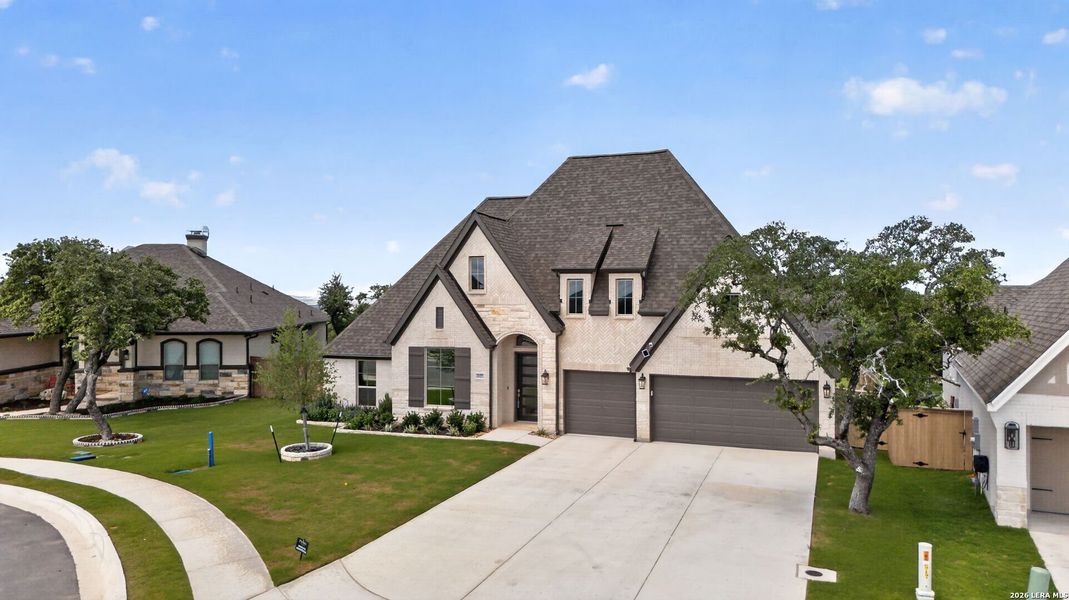 Front exterior of a new home in , Bulverde, TX, highlighting curb appeal (Image 23).