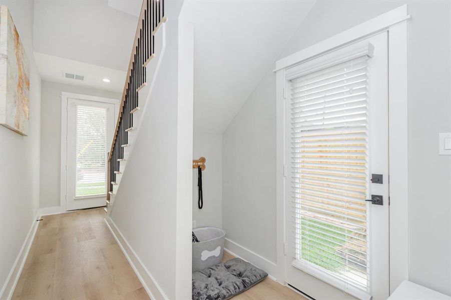 Entering from the backyard or garage, you'll have a mud/pet alcove for convenience.