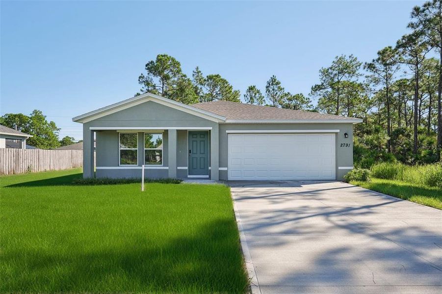 Front exterior of a new home in Palm Bay Classic, Palm Bay, FL, highlighting curb appeal (Image 1).