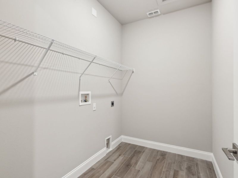 Laundry Room in the Emilia floorplan at 8993 Dahlia Circle