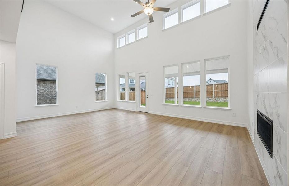 Spacious gathering room with large windows *Model Representation*