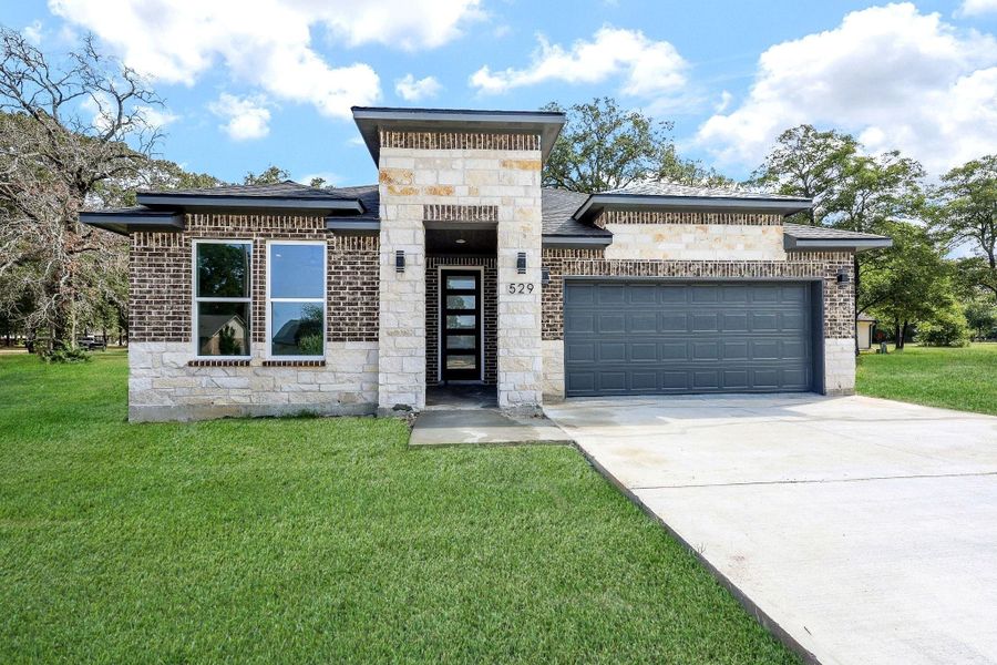 Front exterior of a new home in , Livingston, TX, highlighting curb appeal (Image 2). Front exterior of a new home in , Livingston, TX, highlighting curb appeal (Image 2).