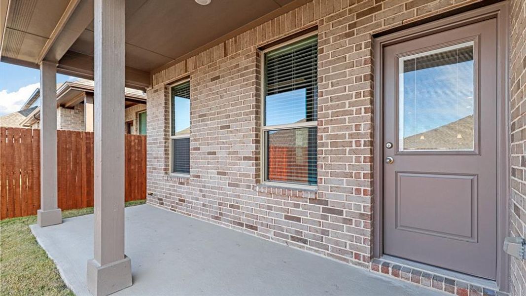 Exterior details and patio area of a home in Treeline, Justin (Image 2).