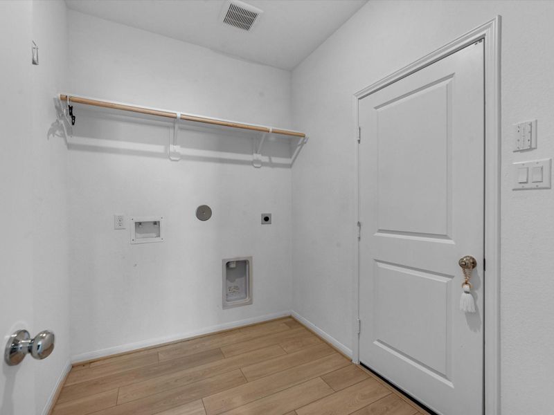 Roomy laundry room that leads to garage Roomy laundry room that leads to garage