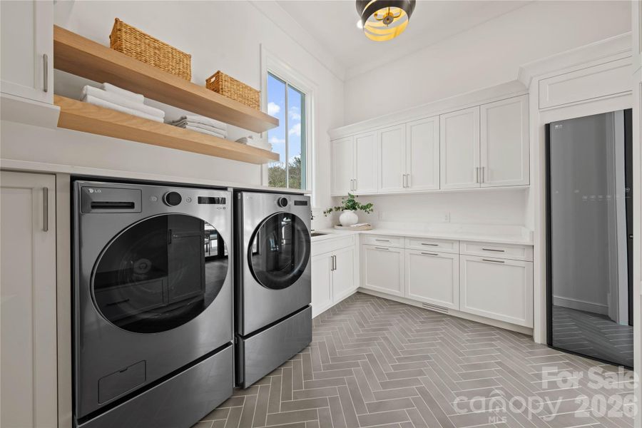 Large laudry room with steamer installed Large laudry room with steamer installed