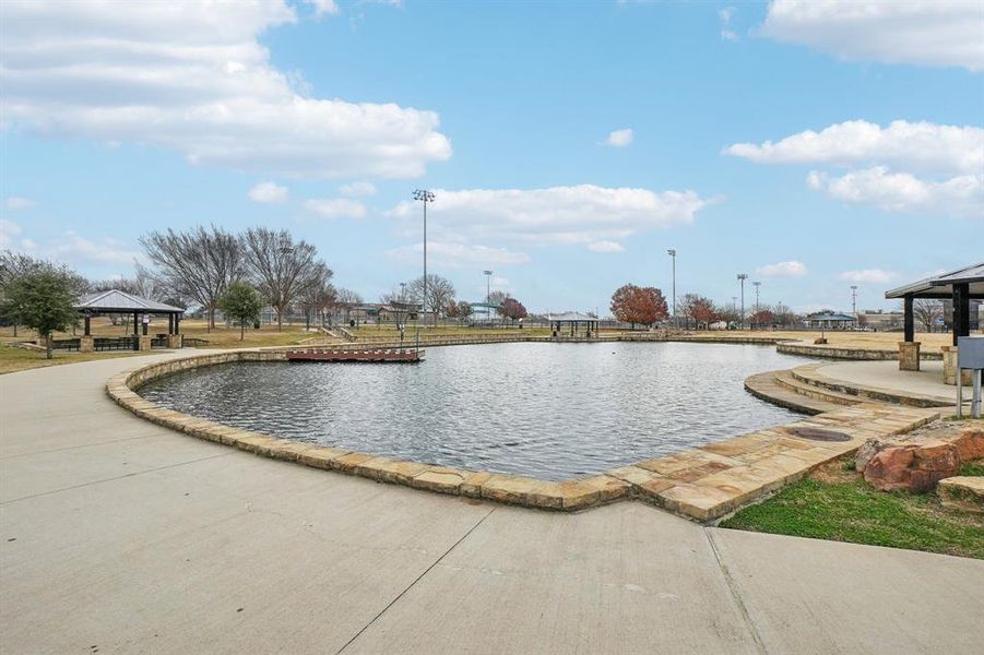 View of swimming pool featuring a gazebo and a water view