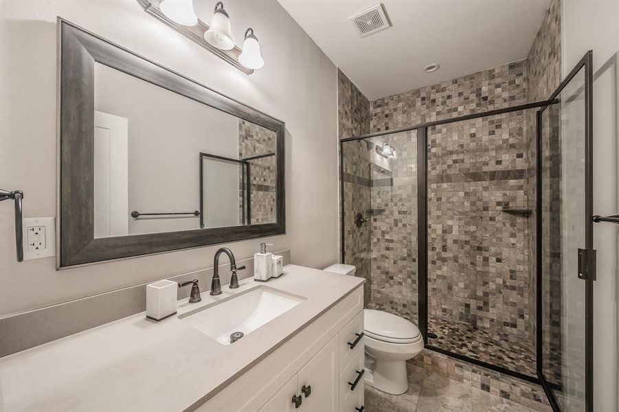 Full bathroom featuring vanity and a shower stall Full bathroom featuring vanity and a shower stall
