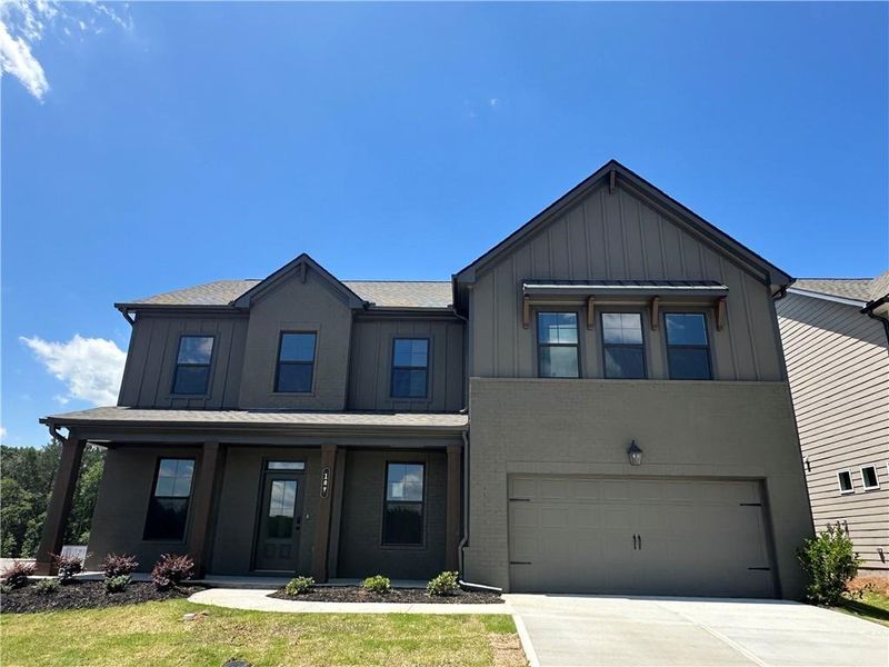 Front exterior of a new home in Summerlin, Winder, GA, highlighting curb appeal (Image 42). Front exterior of a new home in Summerlin, Winder, GA, highlighting curb appeal (Image 42).
