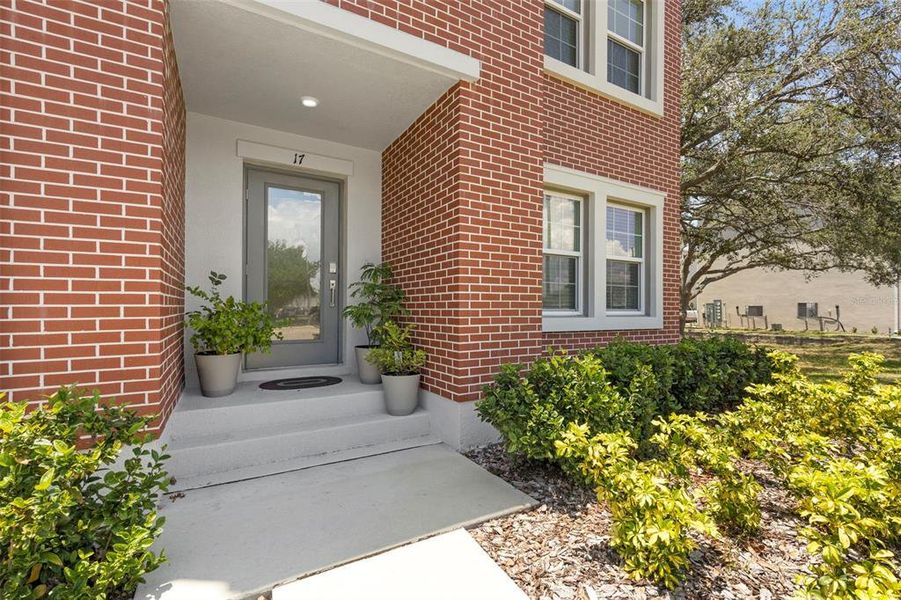 Exterior details and patio area of a home in Townes at Manhattan Crossing, Tampa (Image 3).