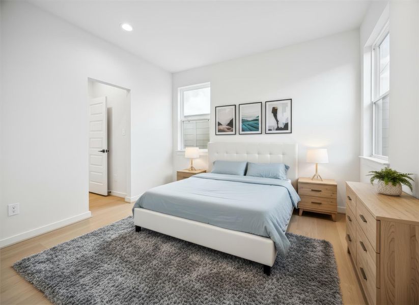 Secondary bedroom off the guest suite features a soothing neutral palette and warm natural light. Ideal for guests or a home office, it offers comfort and privacy with its attached ensuite bath. *Virtually staged*