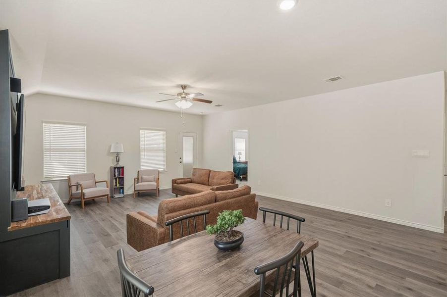 Dining space with light wood-style floors and ceiling fan Dining space with light wood-style floors and ceiling fan