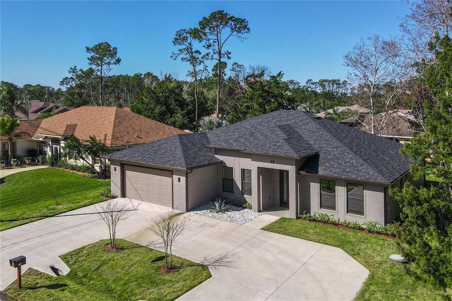 Front exterior of a new home in , Palm Coast, FL, highlighting curb appeal (Image 27).