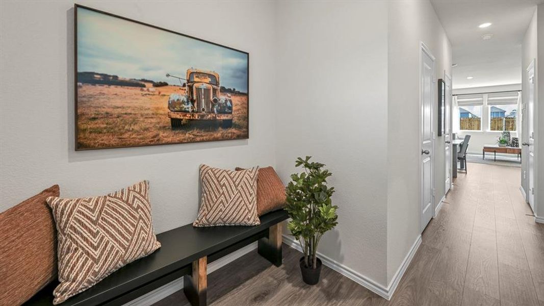 Hall with dark wood-style floors and recessed lighting