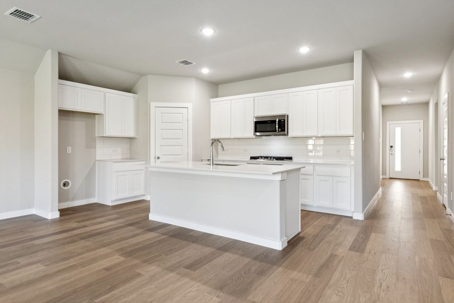 Kitchen in the Emmy II home plan by Trophy Signature Homes - REPRESENTATIVE PHOTO Kitchen in the Emmy II home plan by Trophy Signature Homes - REPRESENTATIVE PHOTO