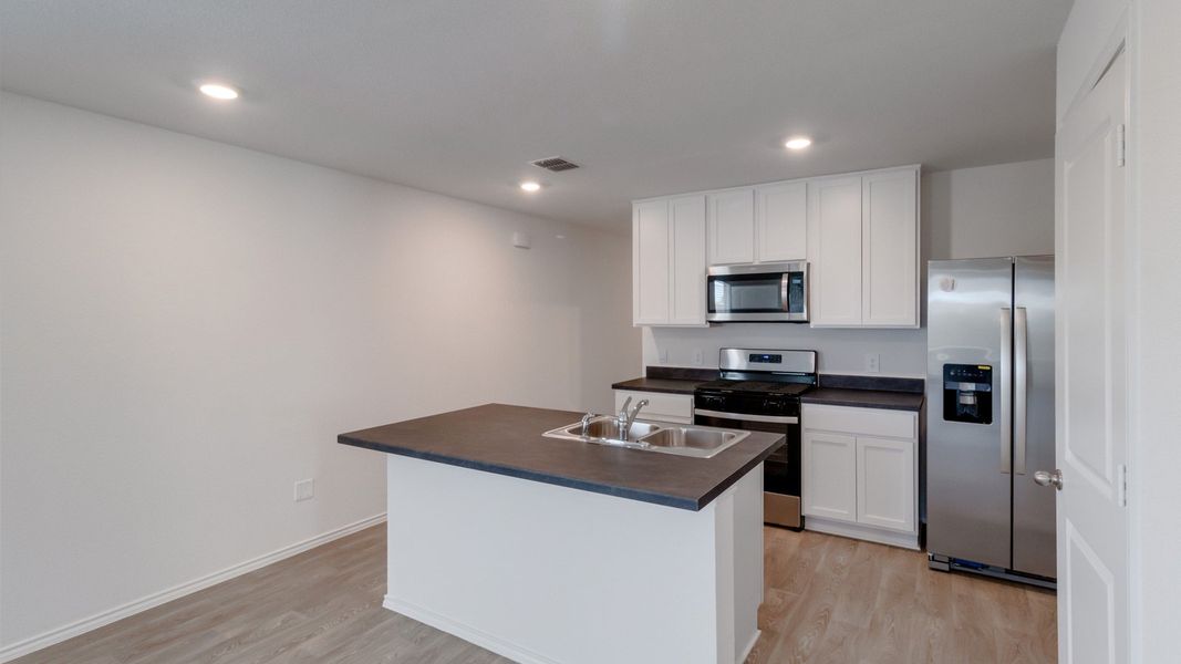 Representative furnished interior of a home built from the The Caprock by D.R. Horton in Watermill, Uhland (Image 6).