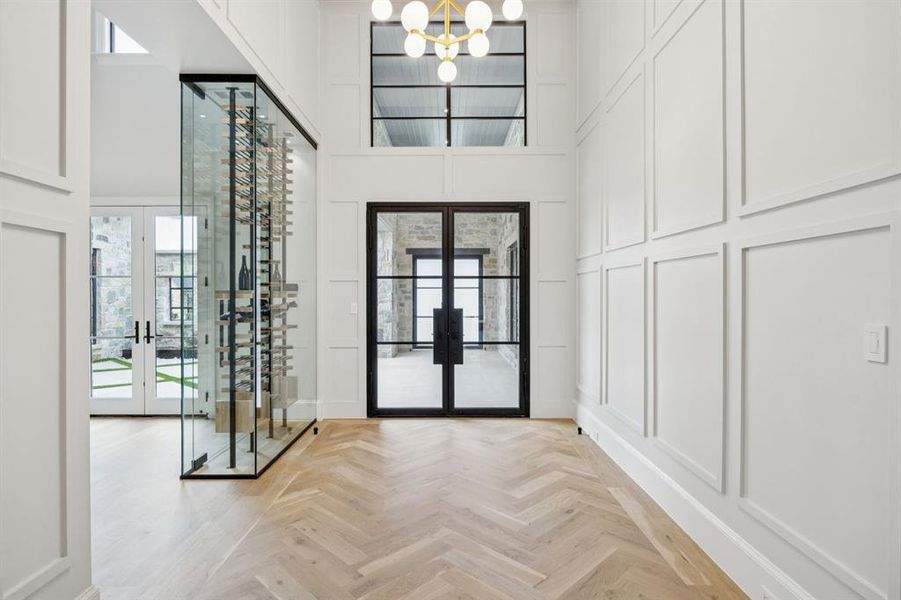 Foyer has temperature controlled wine display with access doors in the formal dining room