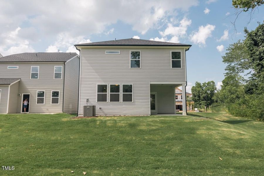 Front exterior of a new home in Gregory Village, Lillington, NC, highlighting curb appeal (Image 103).