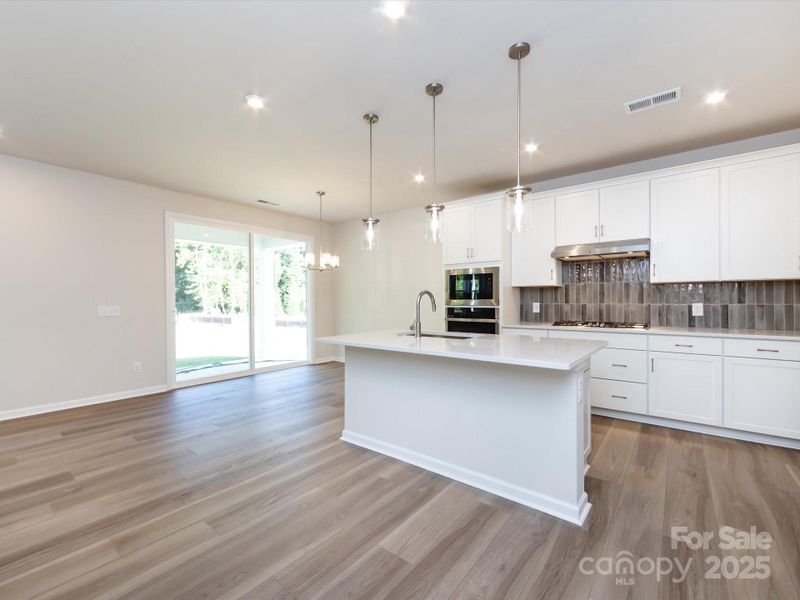 The heart of the home, the kitchen, is a stunning gourmet layout.
