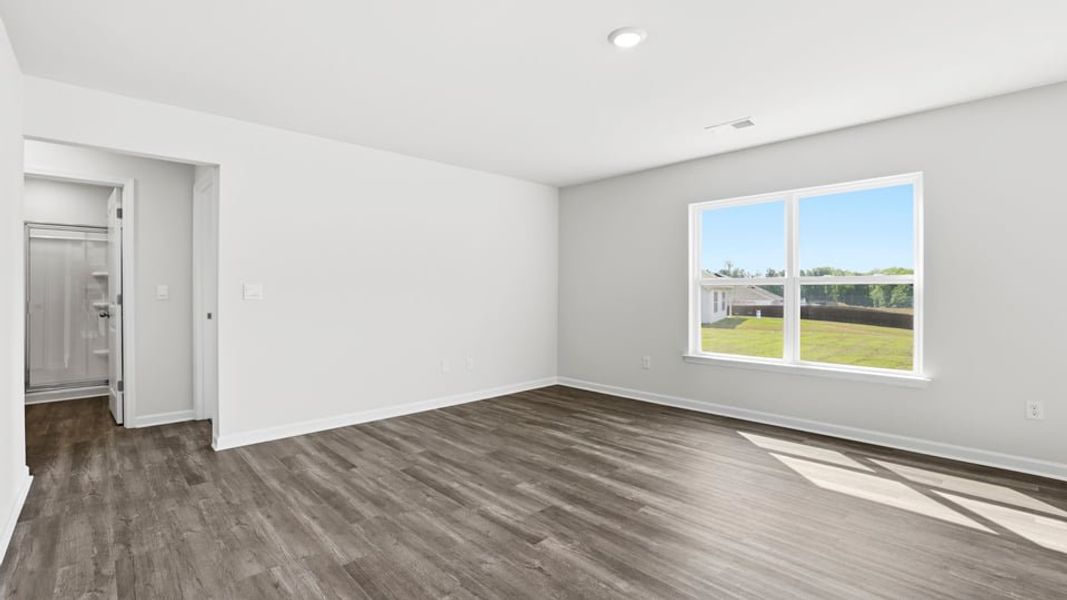 Spacious, unfurnished interior of a new home in Bentley Park, Greenwood (Image 19).