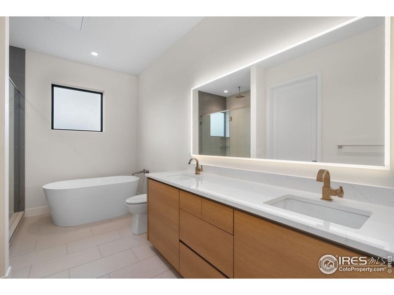 Ensuite includes a back-lit mirror and plenty of counter space