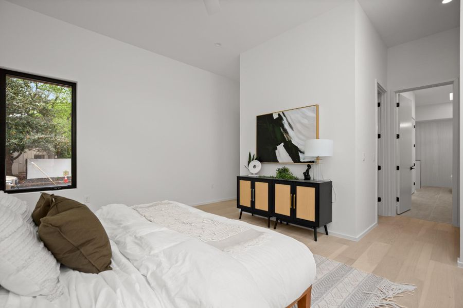 Bedroom featuring light wood-style floors and baseboards
