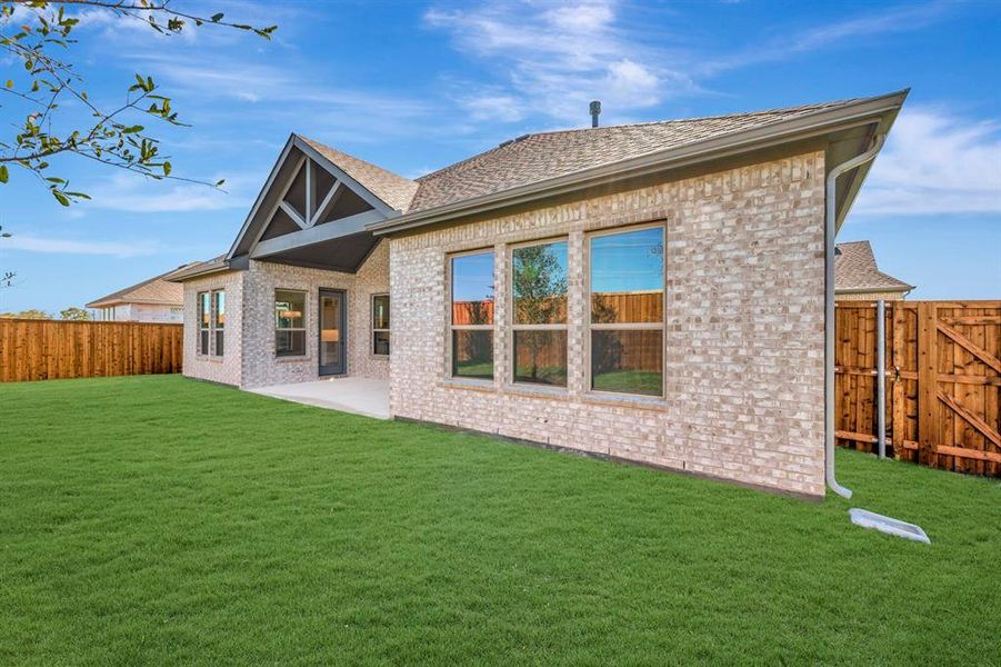Exterior details and patio area of a home in Kreymer at the Park, Wylie (Image 22).