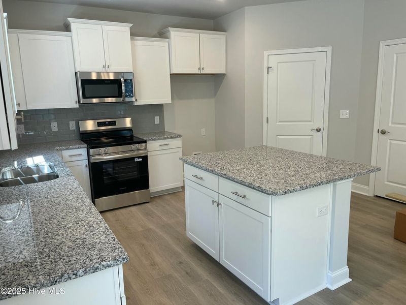 Furnished interior view inside a new home in Mill Creek Cove, Bolivia (Image 5).