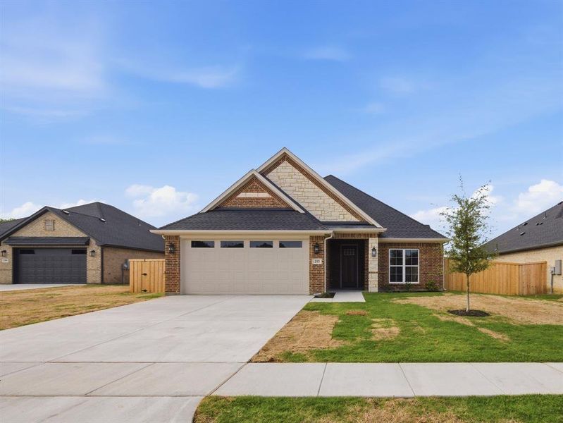 Front exterior of a new home in , Grand Prairie, TX, highlighting curb appeal (Image 14).