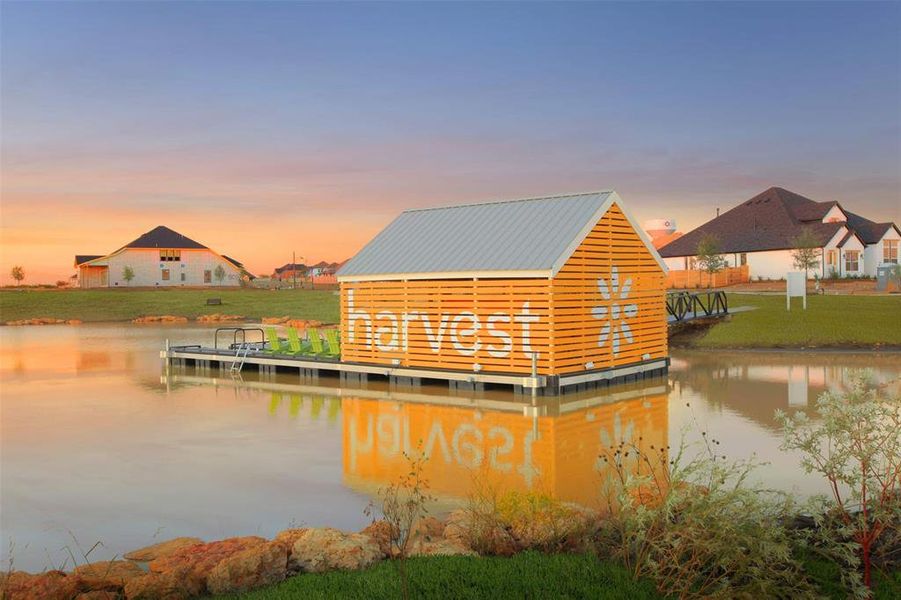 View of dock featuring kayaks a catch and release pond