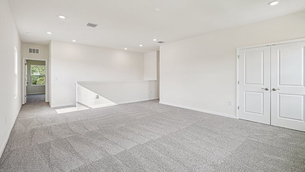 Representative unfurnished interior of a home built from the Coral by D.R. Horton in Oaks Preserve, Gainesville (Image 23).