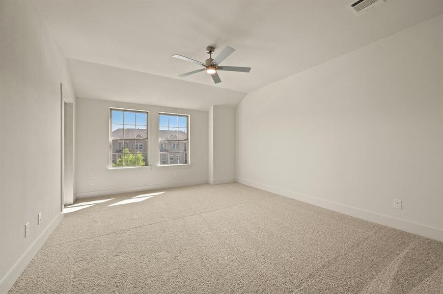 This dreamy owner's bedroom offers plenty of space and natural light.