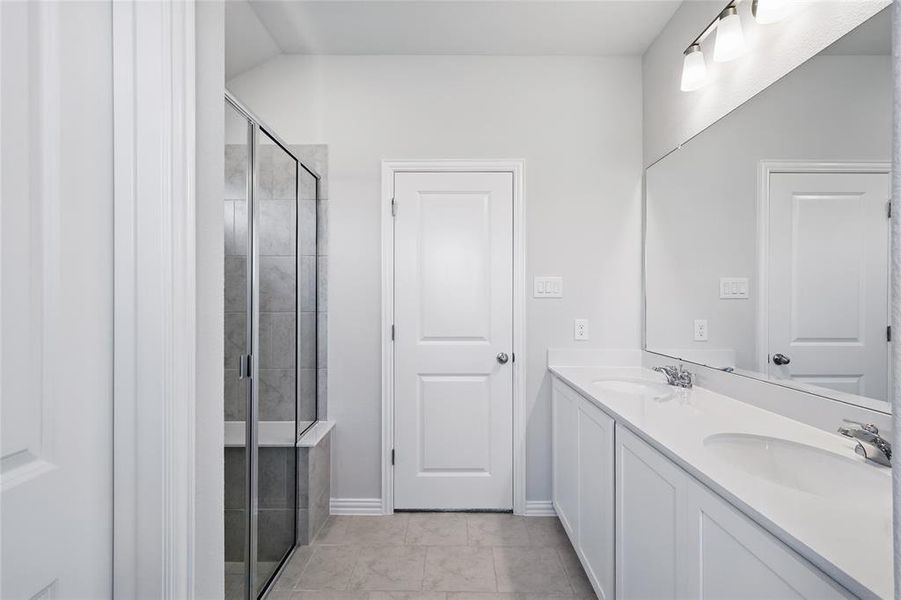 Bathroom with double vanity and a stall shower Bathroom with double vanity and a stall shower