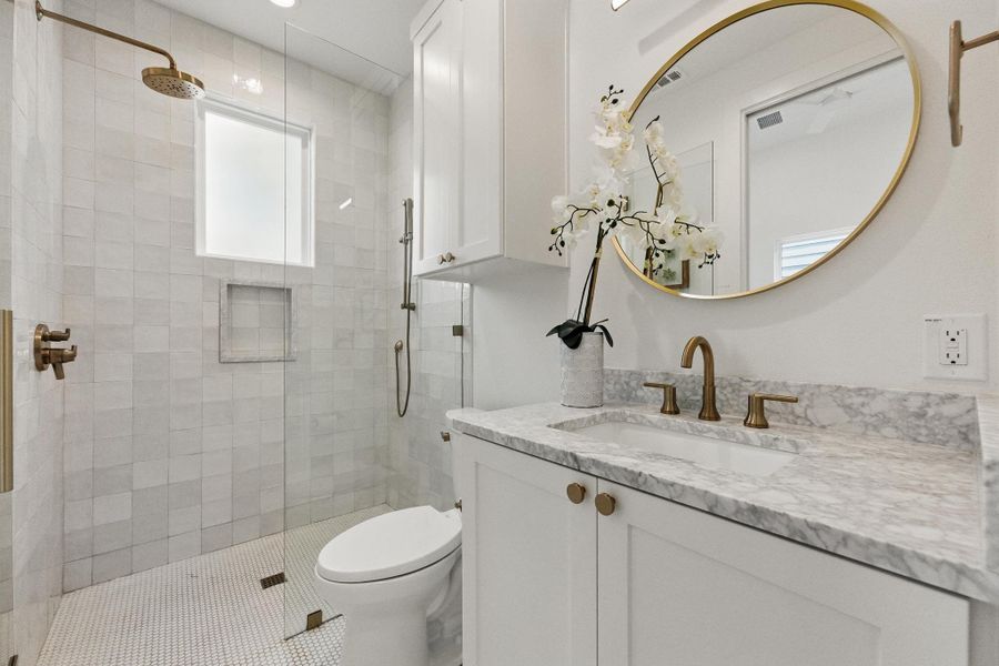 Bathroom with vanity and a stall shower Bathroom with vanity and a stall shower