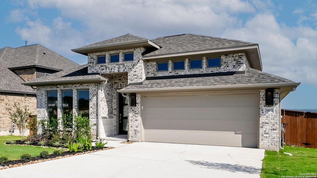 Front exterior of a new home in Homestead 65', Schertz, TX, highlighting curb appeal (Image 24). Front exterior of a new home in Homestead 65', Schertz, TX, highlighting curb appeal (Image 24).