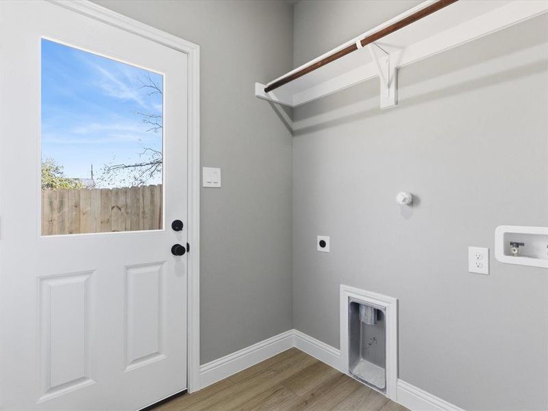 View of back of home with a fenced backyard View of back of home with a fenced backyard