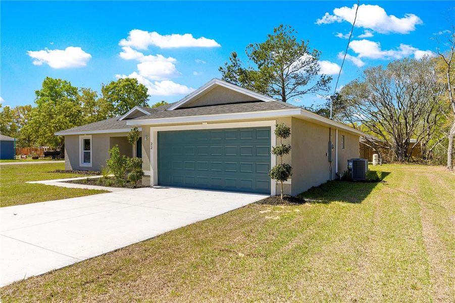 Front exterior of a new home in , Ocklawaha, FL, highlighting curb appeal (Image 19).