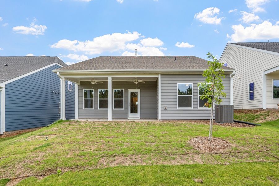 Exterior details and patio area of a home in Ovation at Sweetbrier, Durham (Image 21).