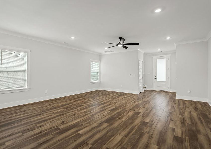 Spacious living room with beautiful floors.