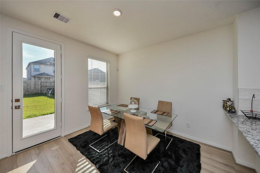 Furnished interior view inside a new home in Sunterra North, Katy (Image 11).