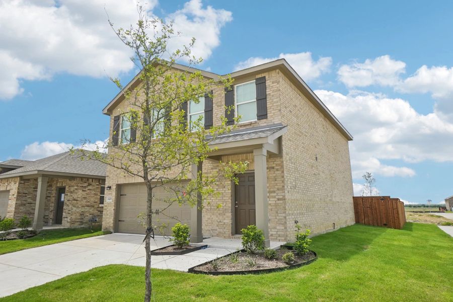 Representative exterior photo of a completed home built from the Voyager by Starlight Homes in Creekview Fossil Ridge, Pilot Point, TX (Image 22).