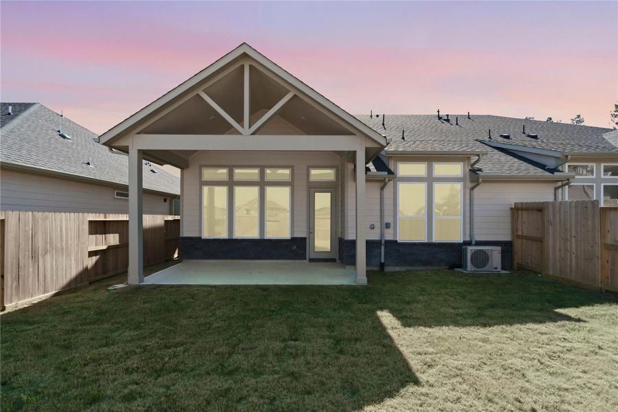 The covered patio offers a functional extension of your indoor living space, providing shade from the sun and shelter from the elements for comfortable outdoor dining or relaxation.