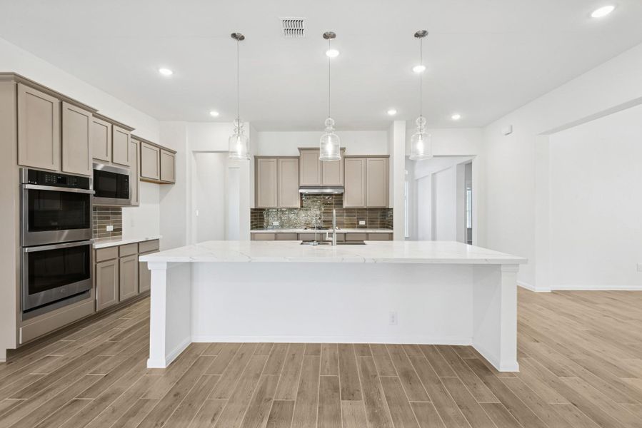 Stunning island kitchen (*Photo not of actual home and used for illustration purposes only.)