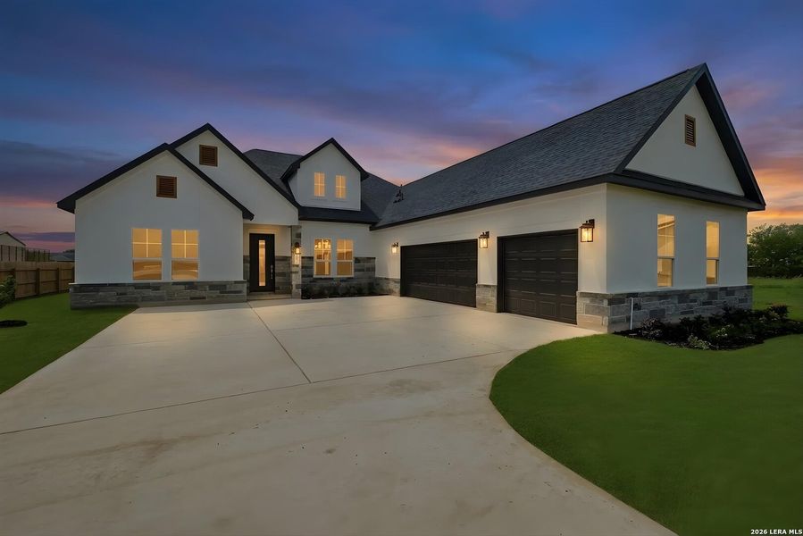 Front exterior of a new home in , Castroville, TX, highlighting curb appeal (Image 15).