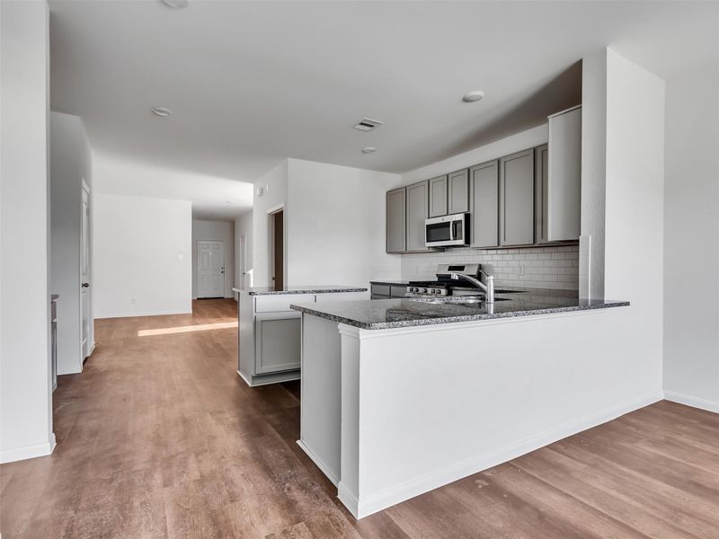 Furnished interior view inside a new home in Sweetgrass Village, Barrett (Image 6).