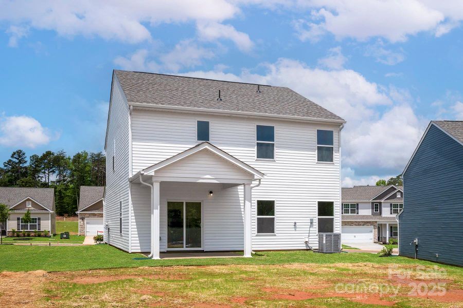 Front exterior of a new home in Ascot Woods, Charlotte, NC, highlighting curb appeal (Image 1).
