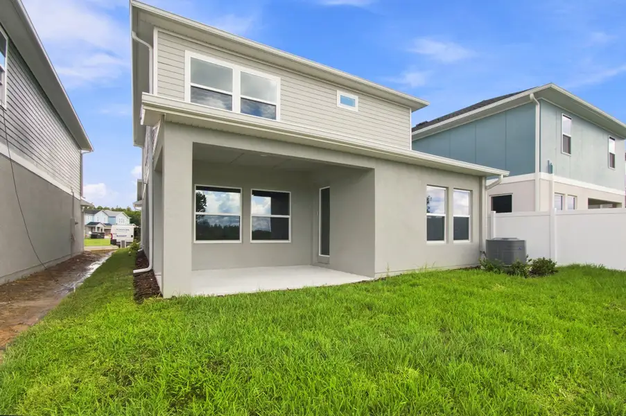 Exterior details and patio area of a home in Persimmon Place – Garden Series, Wesley Chapel (Image 3).