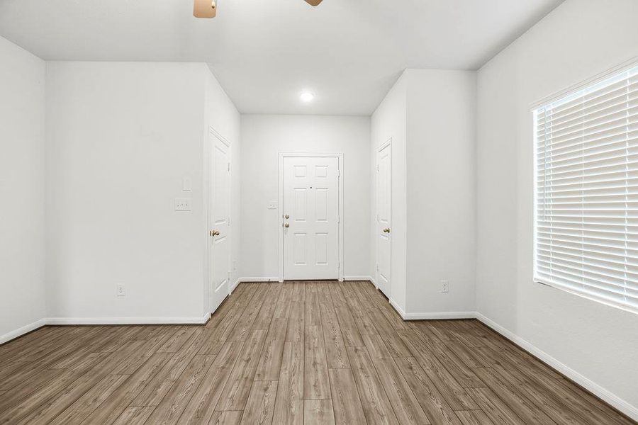 Unfurnished room with wood finished floors, ceiling fan, and recessed lighting