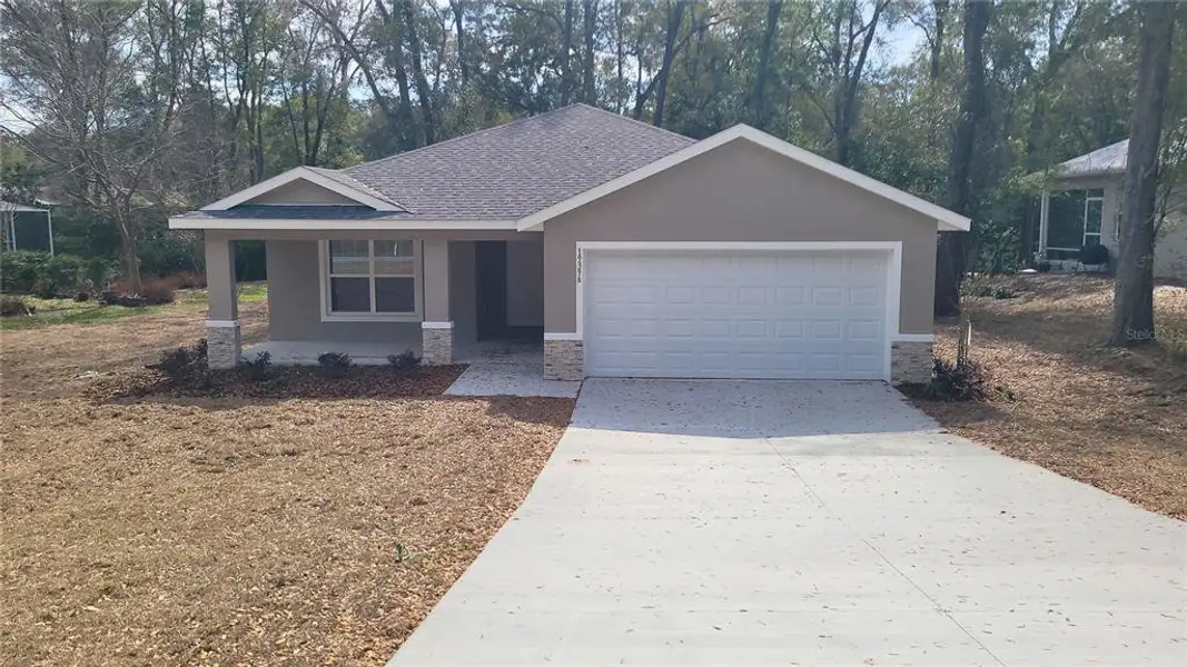 Front exterior of a new home in , Dunnellon, FL, highlighting curb appeal (Image 1). Front exterior of a new home in , Dunnellon, FL, highlighting curb appeal (Image 1).