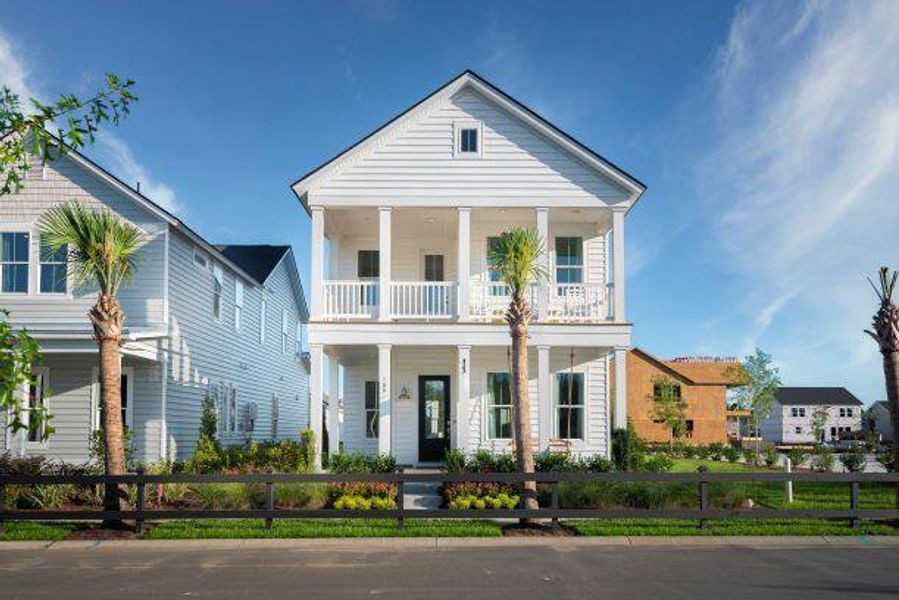 Front exterior of a new home in Heron's Walk at Summers Corner: Row Collection, Summerville, SC, highlighting curb appeal (Image 1).